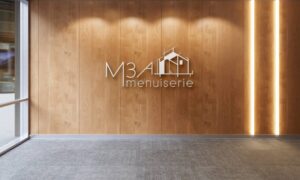 Création d'identité visuelle à Andilly pour M3A Menuiserie, logo sur un mur de bureau